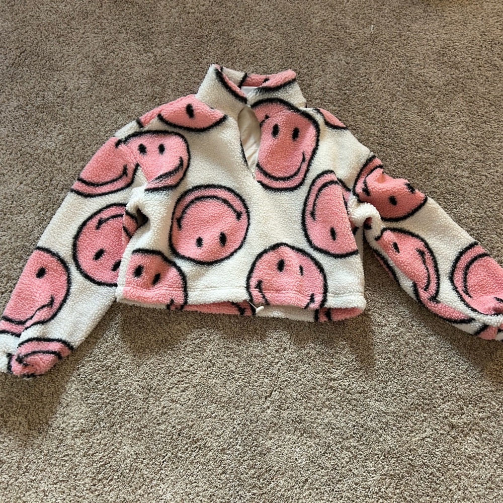 Pink smiley face sweater